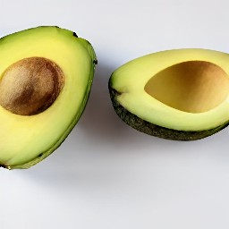 the avocado is cut in half.