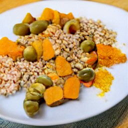 the pearl barley and parsnip are transferred to a plate.