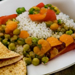 a meal that includes vegetable curry, rice, and flatbread.