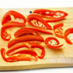 sliced red bell peppers and peeled garlic.