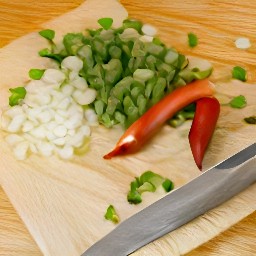 chopped spring onions, red chili pepper, and peeled garlic.