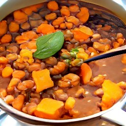 a pot of chili with veggies.