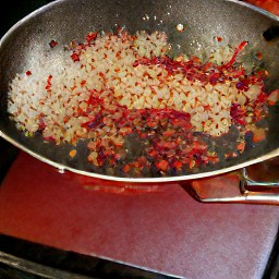 a mixture of fried onions and dried chili peppers.