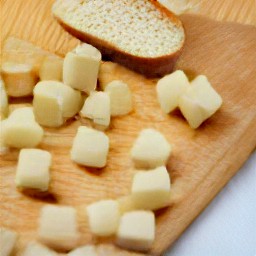 a loaf of stale bread cut into cubes.