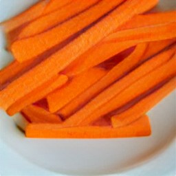 a plate with carrot sticks on it.