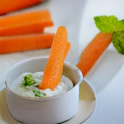 the carrot sticks are served with the pea and mint dip.