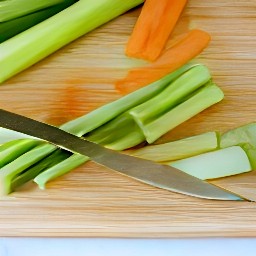 zucchini, carrots, and celery sticks chopped into smaller pieces, with the walnuts also chopped up.