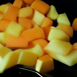peeled potatoes, rutabagas, and carrots that are cut into chunks.
